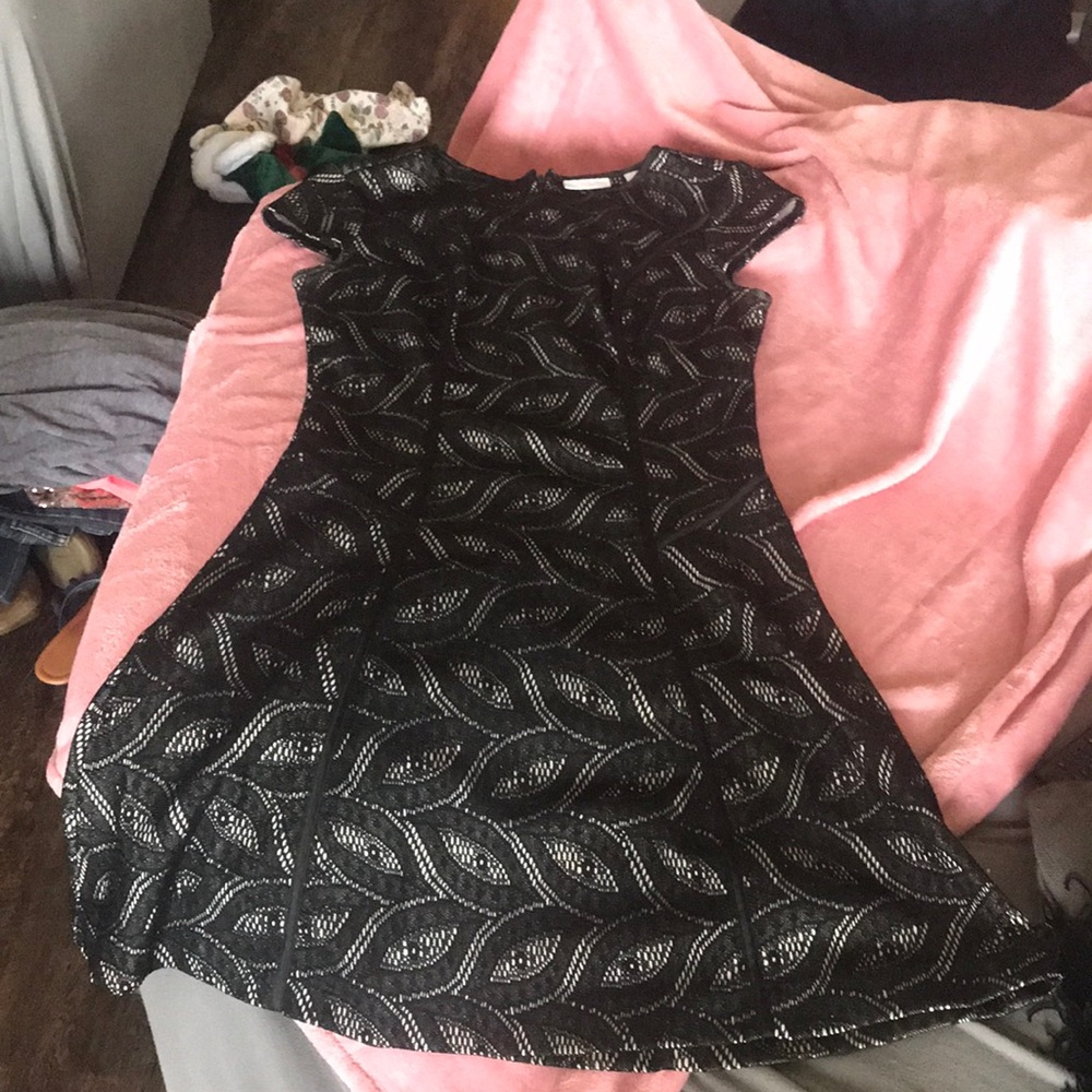 Black dress with eyelets. Fully lined and super flattering